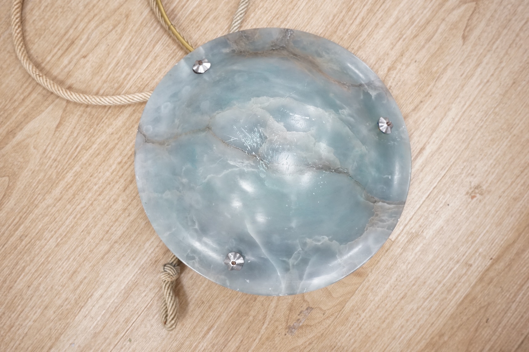 A French Art Deco blue alabaster plafonnier and matching ceiling rose, with cream cord, inscribed number, 30cm diameter